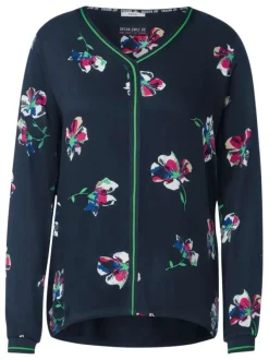 Blouse marine fleurie à col v et à manches longues avec liserés vert