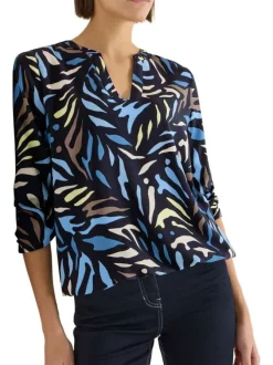 Blouse marine à motifs pourvue de manches longues et d'un col tunisien