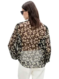 Blouse noire imprimée avec une coupe droite à col rond et des manches longues