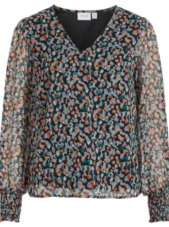 Blouse noire tacheté avec une coupe droite col v et à manches longues