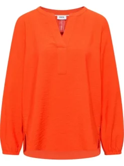Blouse orange unie pourvue d'une coupe droite et d'un col tunisien