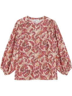 Blouse rose à motifs pourvue d'un col rond et de manches longues