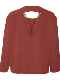 Blouse rouge brique unie dos nu avec une coupe droite un col ras du cou
