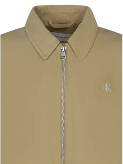 Blouson sable uni avec une coupe droite une fermeture zippée et un col à revers
