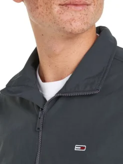 Blouson anthracite uni coupe droite avec un col montant et logo poitrine