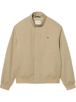 Blouson beige à coupe ajustée pourvu d'un col à boutons pression