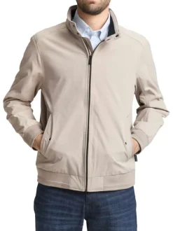 Blouson beige uni avec une coupe droite et deux poches raglan à l’avant