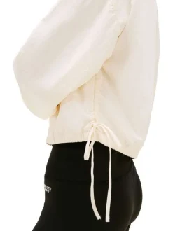 Blouson beige uni avec une coupe droite et un col montant à zip