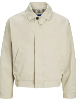 Blouson beige uni coupe droite avec un col français et bouton au col