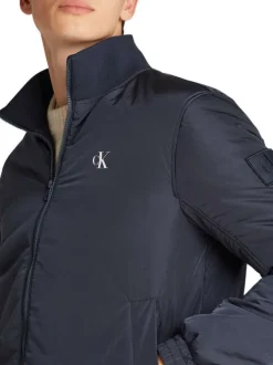 Blouson bleu marine uni avec une coupe droite et un col montant