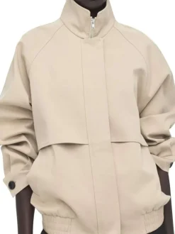 Blouson en coton beige uni pourvu d'une coupe droite et d'un col montant