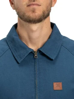 Blouson en coton indigo avec un col chemise et fermeture à glissière