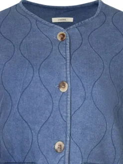 Blouson en coton indigo matelassé à coupe droite avec un col rond