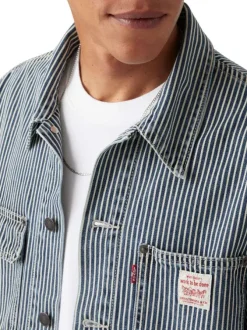 Blouson en jean en coton bleu à rayures avec un col à revers et des poches