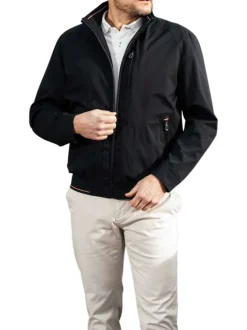 Blouson en nylon bleu marine uni zippé avec un col montant et des poches