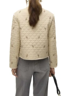 Blouson manches longues écru matelassé avec une coupe droite et un col rond