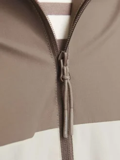 Blouson manches longues marron et beige à coupe droite avec col à capuche