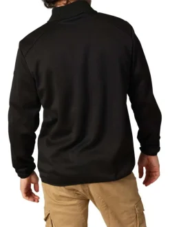Blouson marine avec un col montant zippé et logo de la marque sur une manche