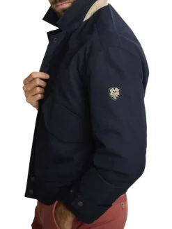 Blouson marine uni avec une coupe ajustée, un zip et des boutons-pressions