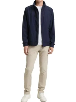 Blouson marine uni avec une coupe droite et des poches zippées à l’avant