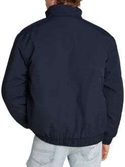Blouson marine uni à coupe droite, col montant zippé et logo brodé