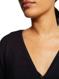 Boléro marine en maille jersey à coupe droite col v et à manches longues