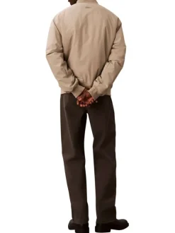 Bomber beige à coupe ajustée pourvu d'une fermeture zippée argentée