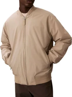 Bomber beige à coupe ajustée pourvu d'une fermeture zippée argentée