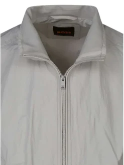 Bomber beige uni avec une coupe droite fluide et un col montant