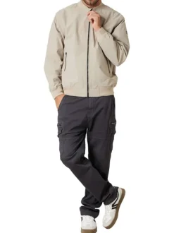 Bomber beige uni pourvu d'une coupe droite et d'un col montant