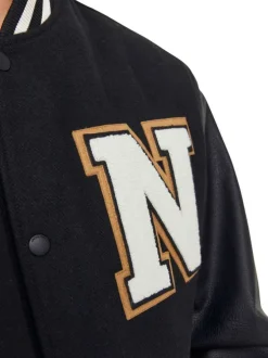 Bomber noir uni avec une coupe droite et un col Teddy en bord côte
