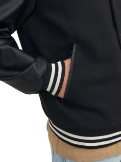 Bomber noir uni avec une coupe droite et un col Teddy en bord côte