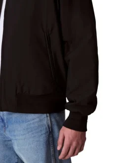 Bomber noir uni zippé à l'avant avec une coupe droite et des poches zippées