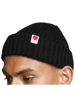 Bonnet en coton biologique noir uni avec étiquette blanche cousue