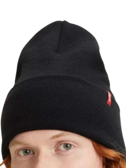 Bonnet noir uni avec large revers et étiquette cousue de la marque