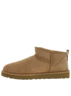 Boots en cuir camel à talon plat avec une doublure en fausse fourrure