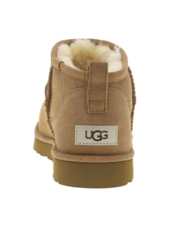 Boots en cuir camel à talon plat avec une doublure en fausse fourrure