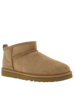 Boots en cuir camel à talon plat avec une doublure en fausse fourrure