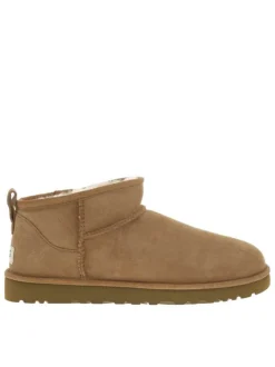 Boots en cuir camel à talon plat avec une doublure en fausse fourrure