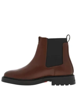Boots en cuir cognac à talon décroché bas avec des soufflets élastiqués