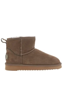 Boots en cuir de vachette beige, fourrées en laine, à semelle plate adhérente