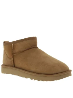Boots en cuir naturel à talon plat avec intérieur fourré et patch de la marque