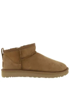 Boots en cuir naturel à talon plat avec intérieur fourré et patch de la marque