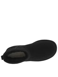 Boots en cuir noires à semelle à talon semi-compensée et fourrure