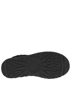 Boots en cuir noires à talon plat avec col brodé, sherpa et intérieur fourré
