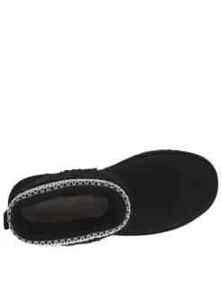 Boots en cuir noires à talon plat avec col brodé, sherpa et intérieur fourré