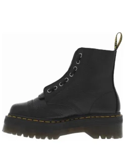 Boots en cuir noires à talon plateau avec un zip et revêtement en grains