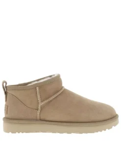 Boots en cuir sable à talon plat avec une languette d'enfilage