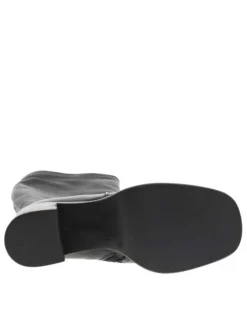 Bottes en cuir noires à semelle à talon décroché haut et fermeture zippée