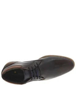 Bottines en cuir brunes avec un talon décroché bas et des lacets